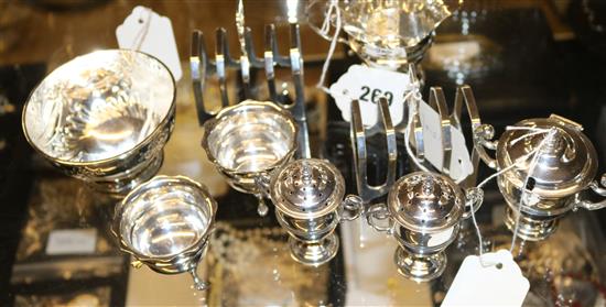 Quantity of silver condiments, pair of toast racks, small bowl, etc